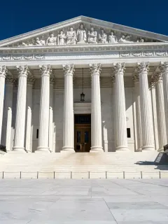 Supreme Court building exterior, neoclassical architecture, judicial power symbol